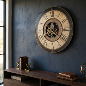 Antique brass wall clock with Roman numerals and rotating gear detail